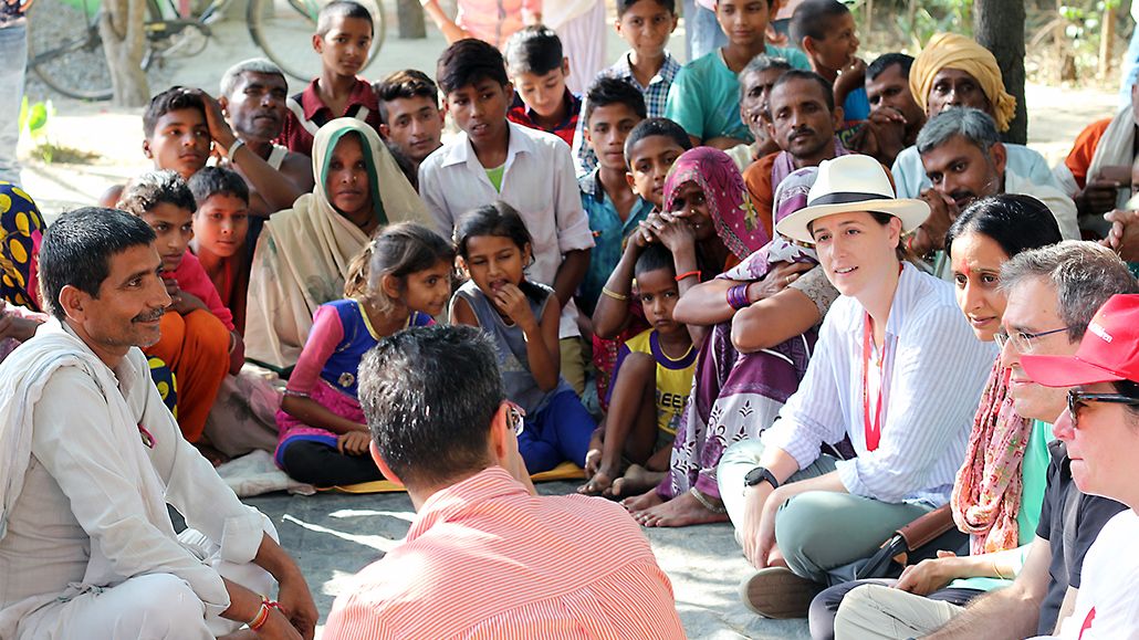 Pfizer colleague talking to group of people in India