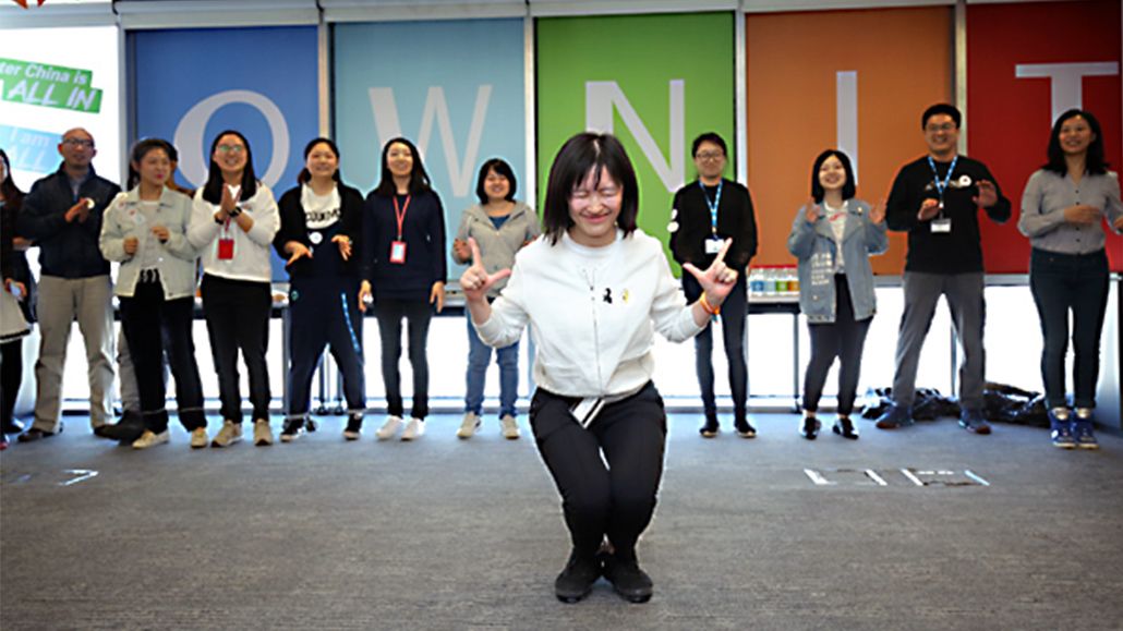 Asia Pacific/Beijing, China: In a “Wake Up Your Energy” session, colleagues gathered for a 20-second dance-off featuring a variety of music that encouraged self-expression in their dance style. Zhao Yi, Assistant to the Greater China Finance Vice President, dances to her own beat before selecting another colleague to dance to the next music clip