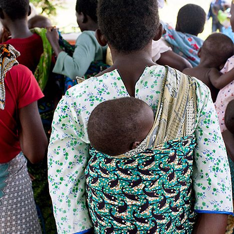 Lady carrying child on her back