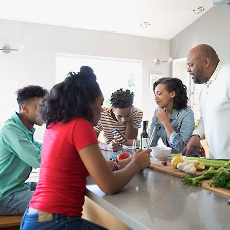 Family talking in kitchen