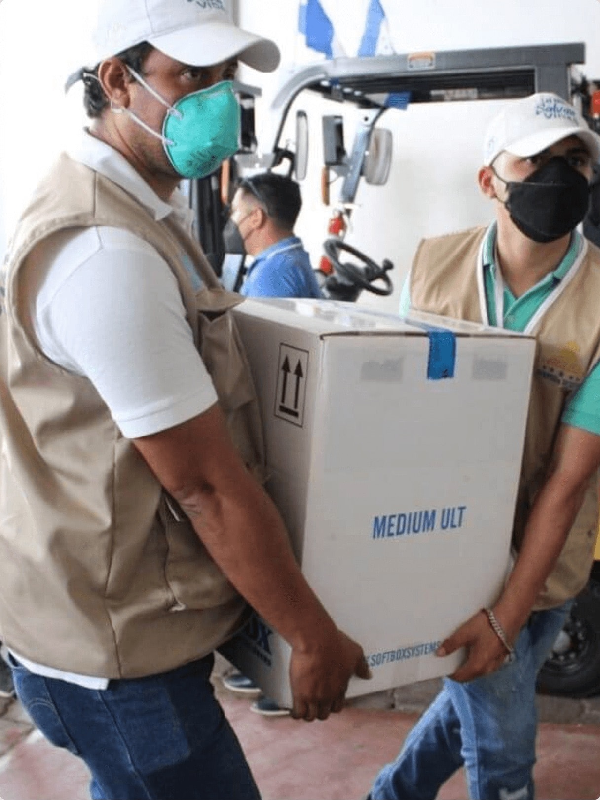 Two workers delivering medicines 