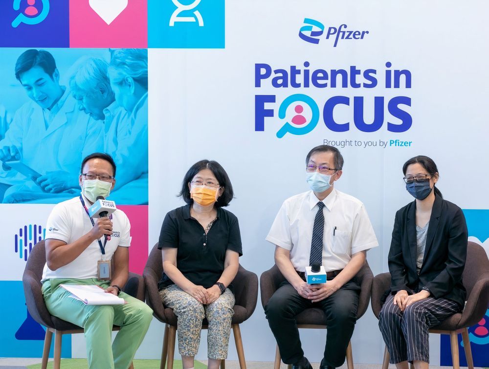 Four colleagues and patient advocacy group leaders seated side by side on stage for Patients in Focus Week event