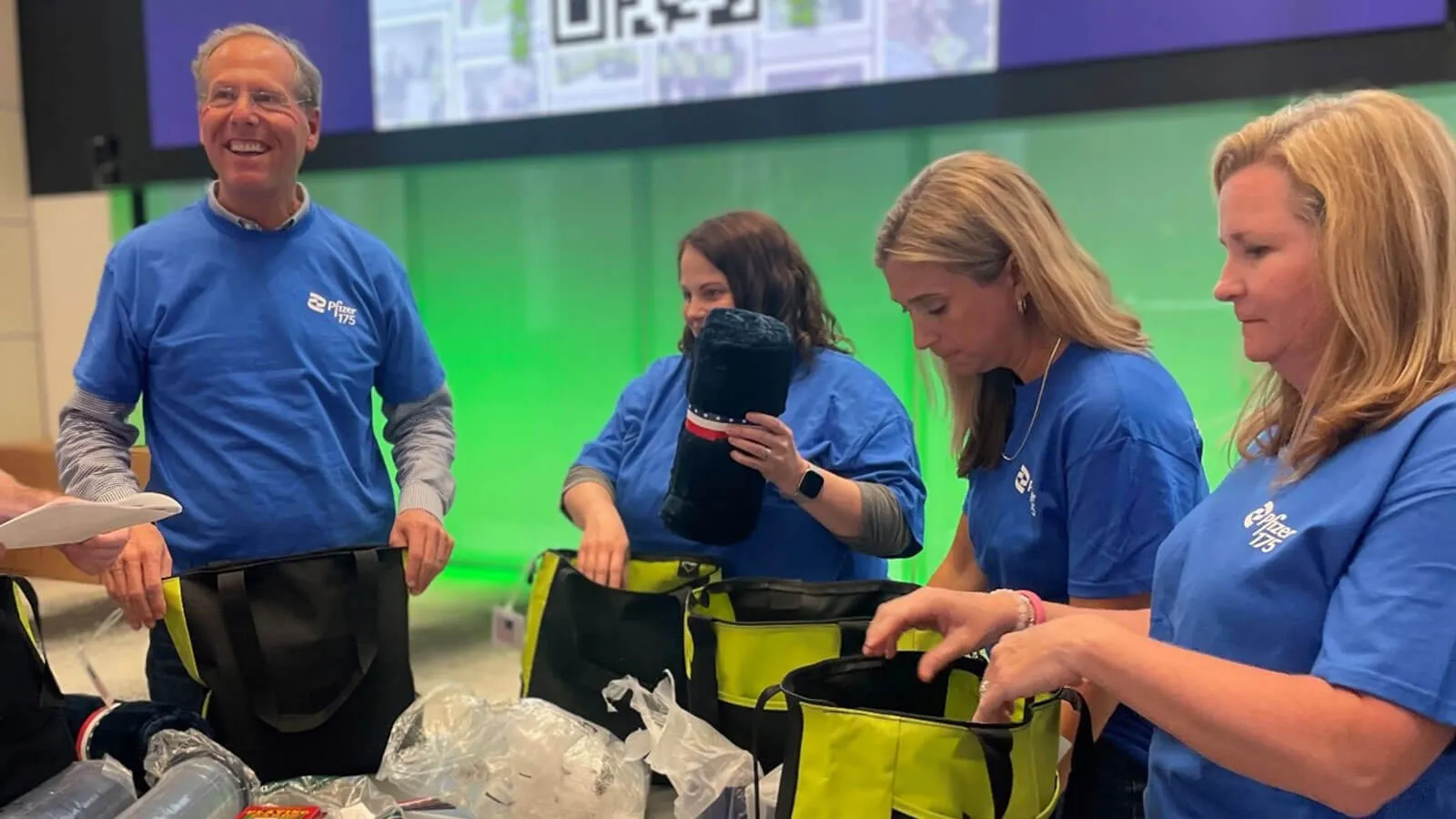 Dave Denton and Pfizer colleagues packing “Cheer kits”