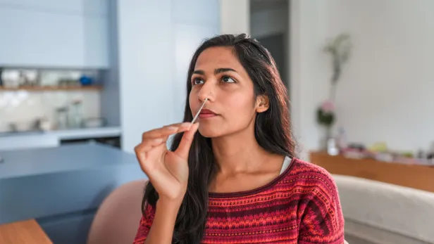 Woman taking a covid test