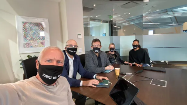 Pfizer leadership gathered in a conference room